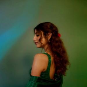 Actress Priya Warrior Dazzles in a Shimmering Green Gown