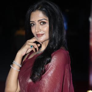 Actress Vimala Raman Exudes Glamour in a Maroon Silk Saree