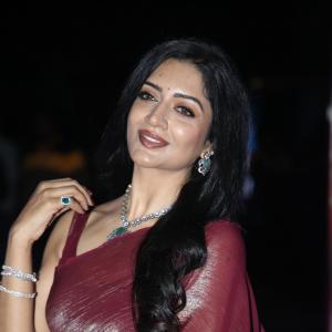 Actress Vimala Raman Exudes Glamour in a Maroon Silk Saree