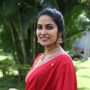 Actress Divi in Elegant Red Saree with Gold Jewelry