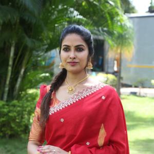 Actress Divi in Elegant Red Saree with Gold Jewelry