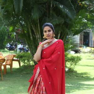 Actress Divi in Elegant Red Saree with Gold Jewelry