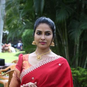Actress Divi in Elegant Red Saree with Gold Jewelry