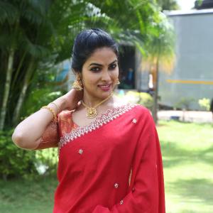 Actress Divi in Elegant Red Saree with Gold Jewelry