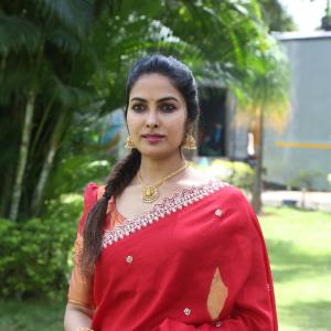 Actress Divi in Elegant Red Saree with Gold Jewelry