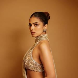 Actress Malavika Mohanan Radiates Golden Elegance and Timeless Beauty