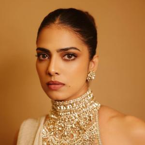 Actress Malavika Mohanan Radiates Golden Elegance and Timeless Beauty