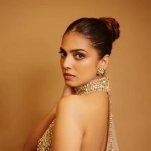 Actress Malavika Mohanan Radiates Golden Elegance and Timeless Beauty