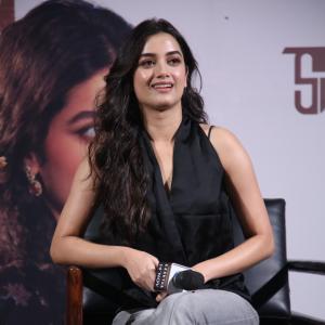 Bhagya Sree Borse Looks Chic in Black Sleeveless Top and Grey Pants at Media Event
