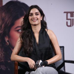 Bhagya Sree Borse Looks Chic in Black Sleeveless Top and Grey Pants at Media Event