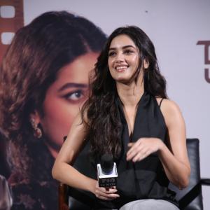 Bhagya Sree Borse Looks Chic in Black Sleeveless Top and Grey Pants at Media Event