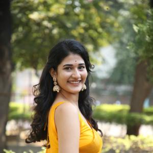 Amrutha Chowdary Shines in a Bright Yellow Saree | Elegant & Graceful Outdoor Photoshoot