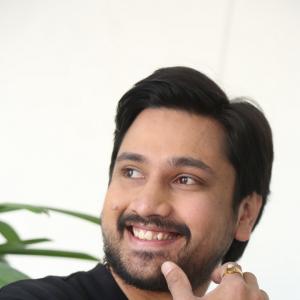 Raj Tharun’s Casual Look: Black Sweatshirt, Denim Style & Warm Smile – Latest Photoshoot