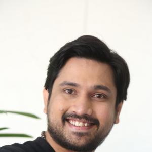 Raj Tharun’s Casual Look: Black Sweatshirt, Denim Style & Warm Smile – Latest Photoshoot