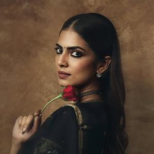 Actress Malavika Mohanan in Elegant Black Saree – Timeless Beauty & Cinematic Portrait