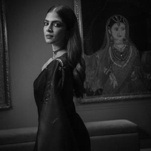 Actress Malavika Mohanan in Elegant Black Saree – Timeless Beauty & Cinematic Portrait