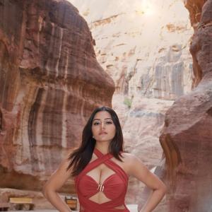 Simran Kaur Stuns in Elegant Red Dress Photoshoot Amid Scenic Rocky Canyon