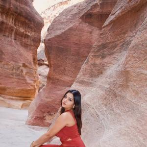 Simran Kaur Stuns in Elegant Red Dress Photoshoot Amid Scenic Rocky Canyon