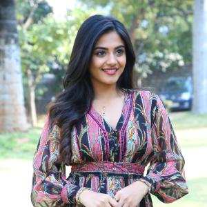 Nayana Sarika Elegant Outdoor Look in Vibrant Printed Dress