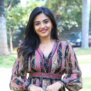 Nayana Sarika Elegant Outdoor Look in Vibrant Printed Dress