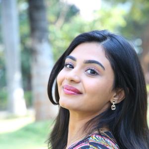 Nayana Sarika Elegant Outdoor Look in Vibrant Printed Dress