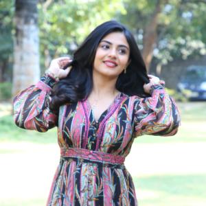 Nayana Sarika Elegant Outdoor Look in Vibrant Printed Dress