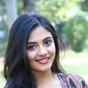 Nayana Sarika Elegant Outdoor Look in Vibrant Printed Dress