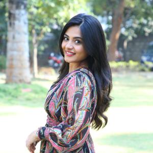Nayana Sarika Elegant Outdoor Look in Vibrant Printed Dress
