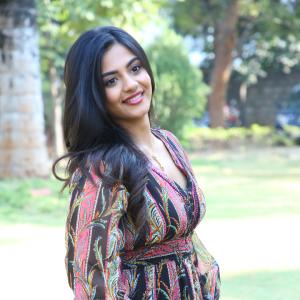 Nayana Sarika Elegant Outdoor Look in Vibrant Printed Dress