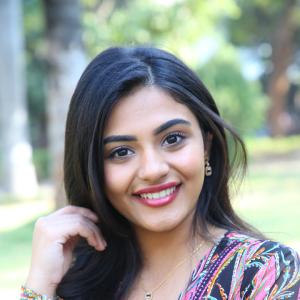 Nayana Sarika Elegant Outdoor Look in Vibrant Printed Dress