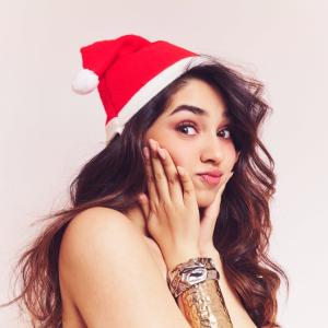 Actress Kriti Shetty Festive Christmas Look in Santa Hat with Playful Holiday Vibes