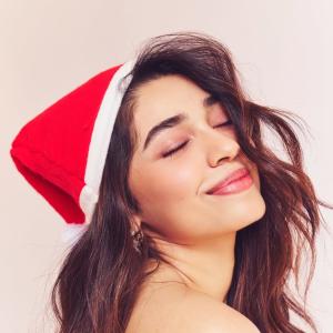Actress Kriti Shetty Festive Christmas Look in Santa Hat with Playful Holiday Vibes
