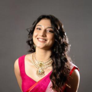 Actress Ritika Nayak Exudes Elegance in Vibrant Pink Saree and Traditional Jewelry