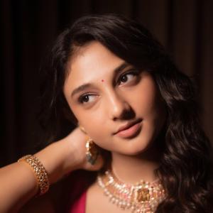 Actress Ritika Nayak Exudes Elegance in Vibrant Pink Saree and Traditional Jewelry