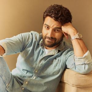 Actor Vishwak Sen's Casual Yet Stylish Look in a Denim Shirt and Relaxed Pose