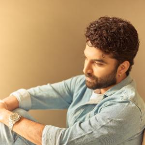 Actor Vishwak Sen's Casual Yet Stylish Look in a Denim Shirt and Relaxed Pose