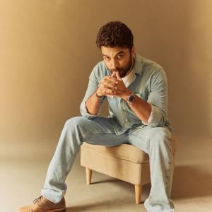Actor Vishwak Sen's Casual Yet Stylish Look in a Denim Shirt and Relaxed Pose