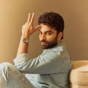 Actor Vishwak Sen's Casual Yet Stylish Look in a Denim Shirt and Relaxed Pose