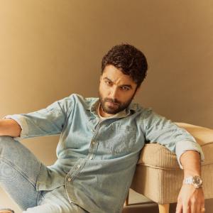 Actor Vishwak Sen's Casual Yet Stylish Look in a Denim Shirt and Relaxed Pose