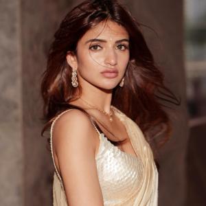 Actress Sreeleela in Elegant Ivory Saree: A Picture of Grace