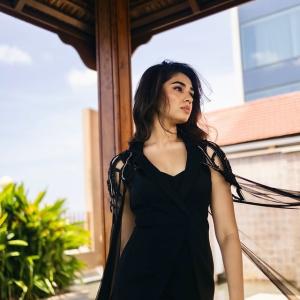 Kriti Shetty: Elegant Black Outfit with Sheer Cape Fashion Look