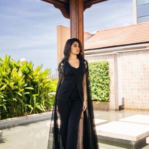 Kriti Shetty: Elegant Black Outfit with Sheer Cape Fashion Look