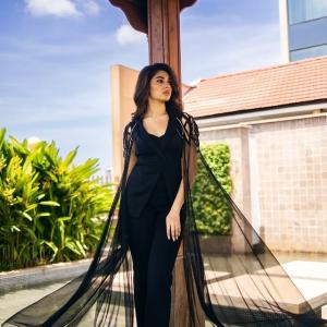 Kriti Shetty: Elegant Black Outfit with Sheer Cape Fashion Look