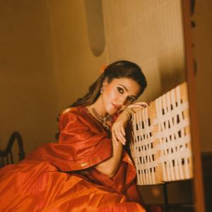 Actress Neha Shetty in Elegant Red Saree with Golden Embroidery and Statement Jewelry