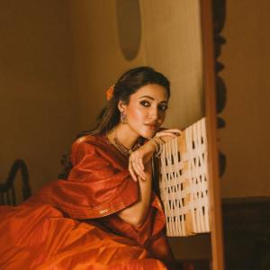 Actress Neha Shetty in Elegant Red Saree with Golden Embroidery and Statement Jewelry