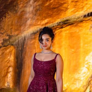 Actress Saanve Megghana in Elegant Maroon Sequin Gown with Jewelry