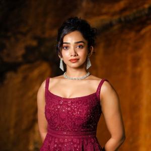 Actress Saanve Megghana in Elegant Maroon Sequin Gown with Jewelry