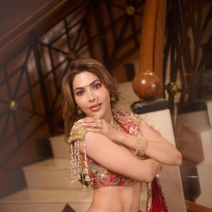 Nikki Tamboli Stuns in Traditional Red Lehenga