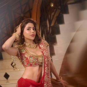 Nikki Tamboli Stuns in Traditional Red Lehenga