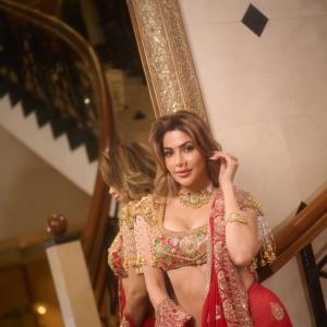 Nikki Tamboli Stuns in Traditional Red Lehenga